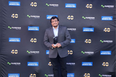 Dr. Abhishek Roychowdhury receiving an award at the ABF’s 40 Under 40