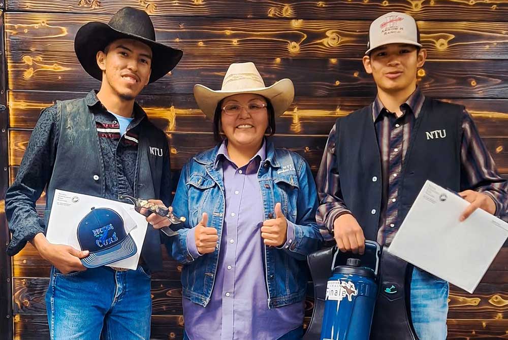 2026 NTU Rodeo. L-R: Isiah Tom, Coach Pino, Alvaro Begay